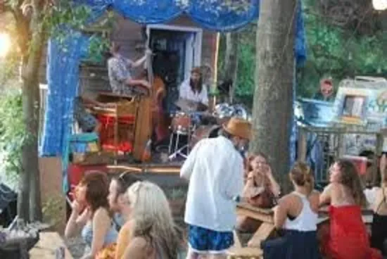 A live band performing for a crowd at Chico Feos on Folly Beach