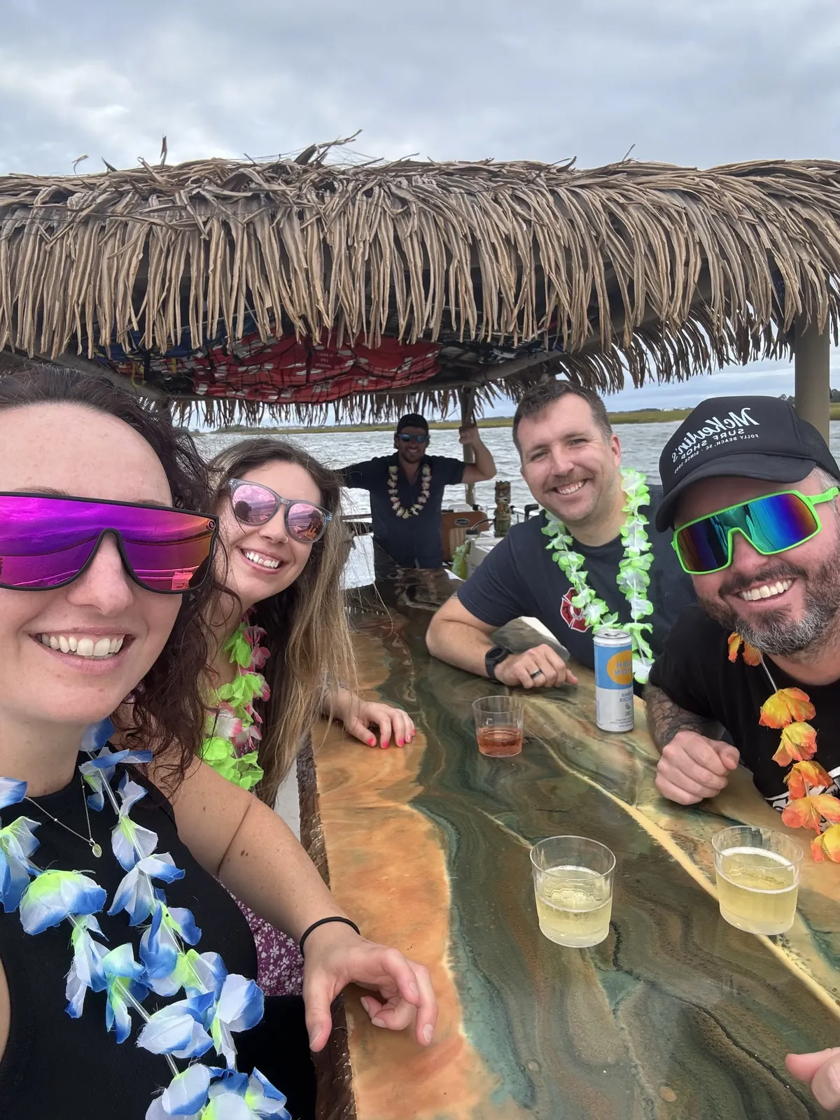 Friends in leis taking a selfie at the onboard bar