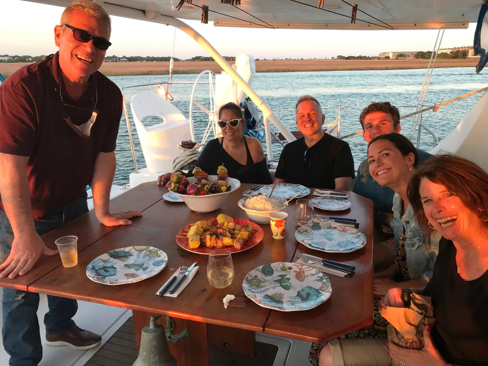 Guests sharing a meal together aboard the sailing catamaran